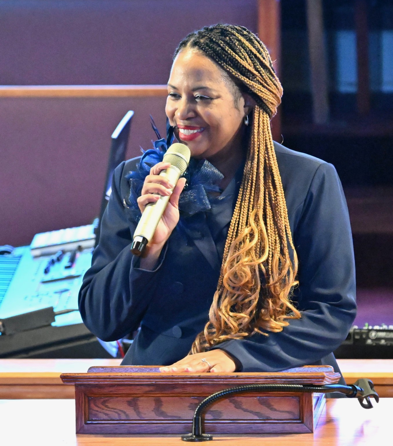Pastor Kimberly Hines speaking at a church podium